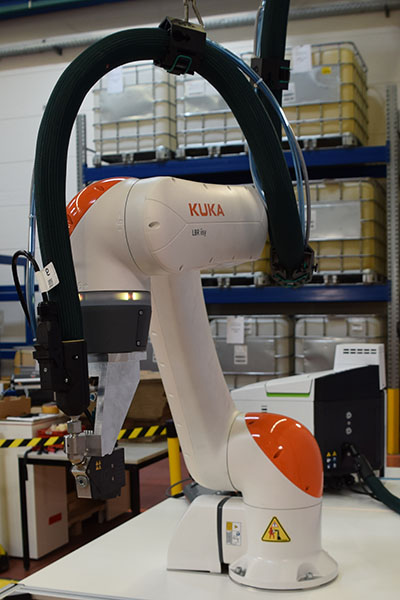 Kuka cobot combined with an adhesive application system from Robatech