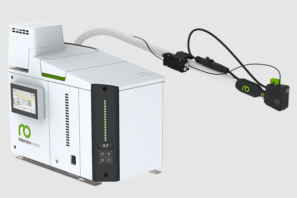 Adhesive application system with the Vision melter, Performa heated hose, and Volta electric jetting head